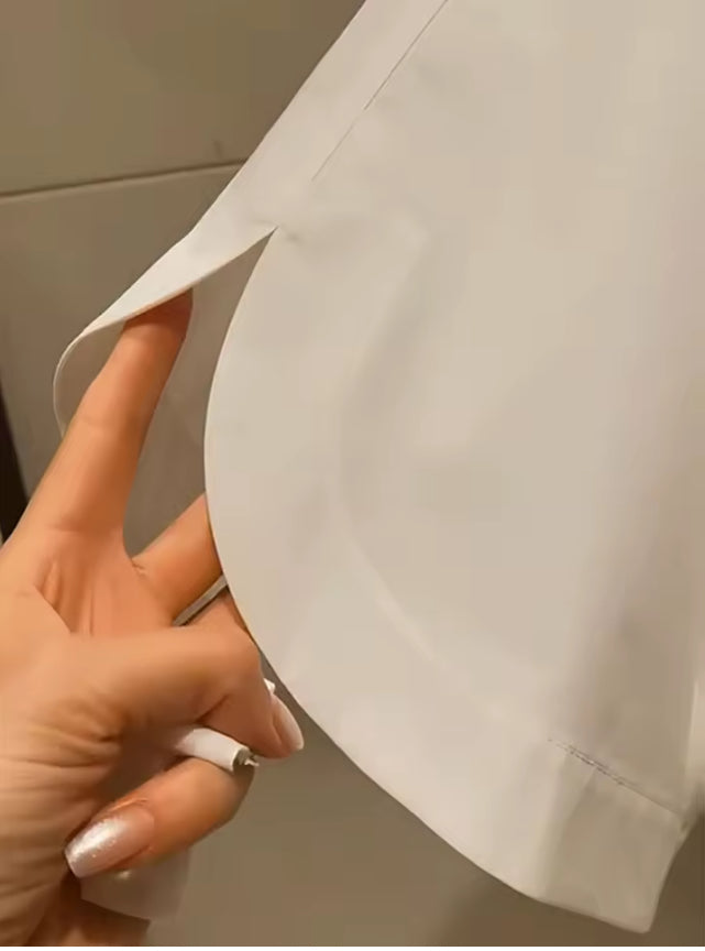 Witte geborduurde blouse met korte vleermuismouwen