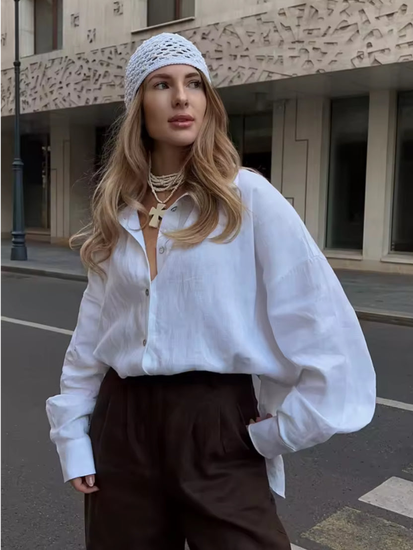 Losvallende katoenen blouse in effen kleur met lange mouwen