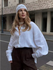 Losvallende katoenen blouse in effen kleur met lange mouwen