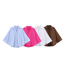 Oversized damesblouse met V-hals en opgerolde mouwen