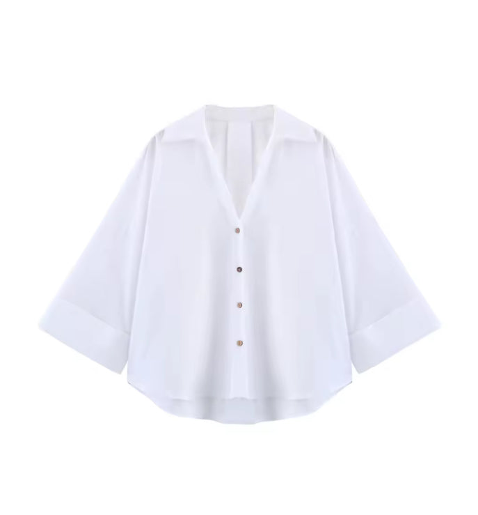 Oversized damesblouse met V-hals en opgerolde mouwen