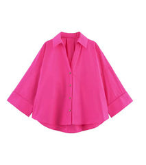 Oversized damesblouse met V-hals en opgerolde mouwen