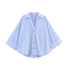 Oversized damesblouse met V-hals en opgerolde mouwen