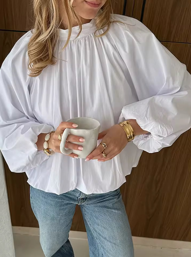 Witte blouse met open rug en strikdetail