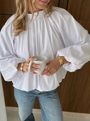 Witte blouse met open rug en strikdetail