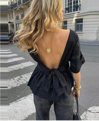 Elegante top met open rug en strikdetail
