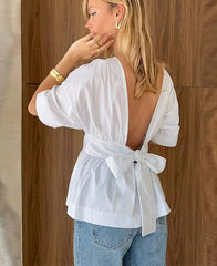 Elegante top met open rug en strikdetail
