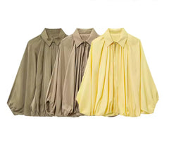 Losvallende blouse met vleermuismouwen en ritssluiting