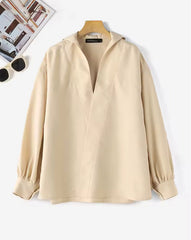 Blouse met diepe V-hals en opstaande kraag