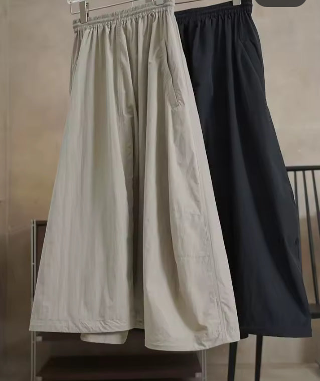 Luchtige A-lijn midi rok met hoge taille en trekkoord